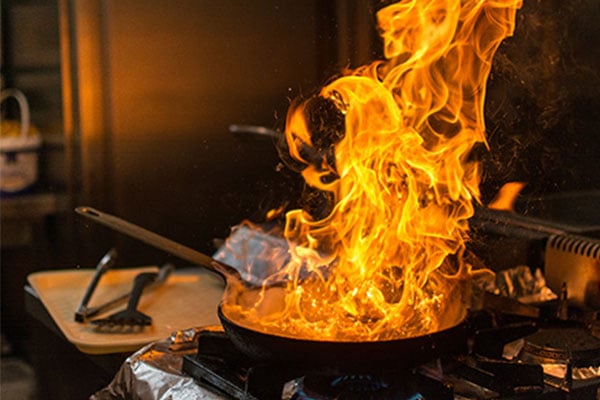 Large fire within a kitchen pan