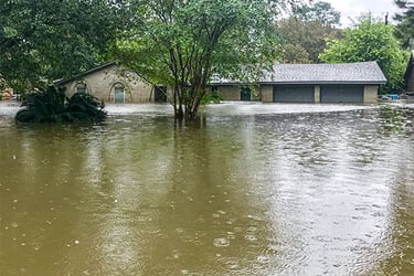 Flooded area with a house partially under water. 