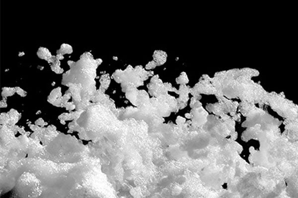 Soap suds flying in the air. 