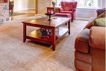 Wood table on beige clean carpet