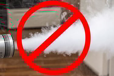 Smoke with a red circle that has a slash through the middle. 