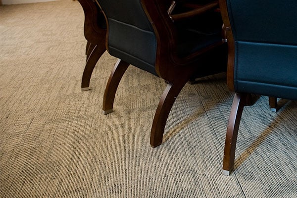 Dark chairs on a carpet 