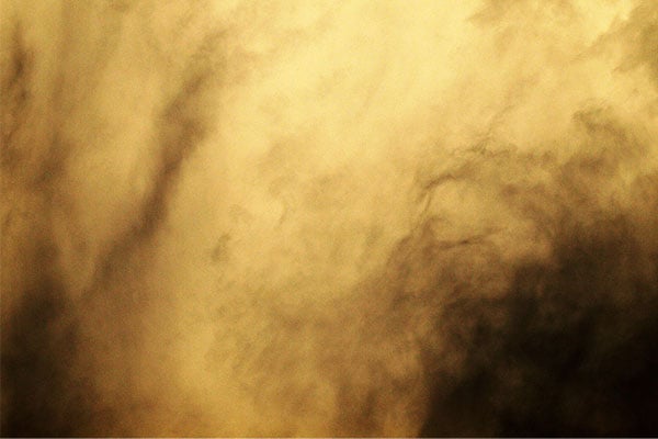 yellowish to dark smoke fills the image. 